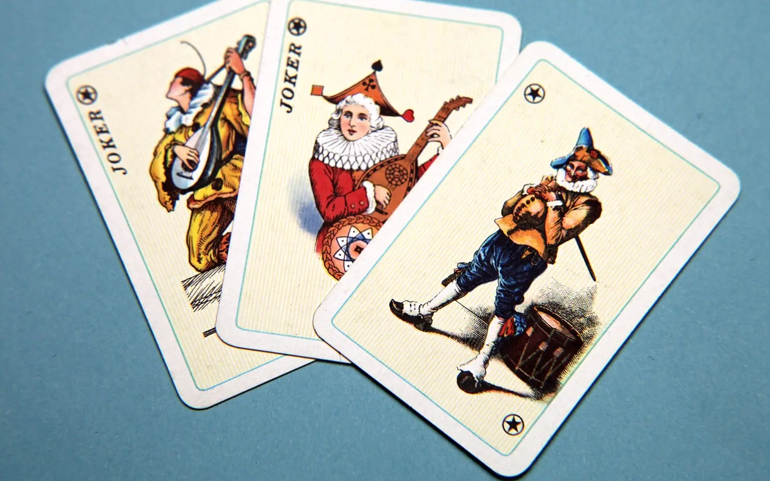 Playing cards, joker and happiness